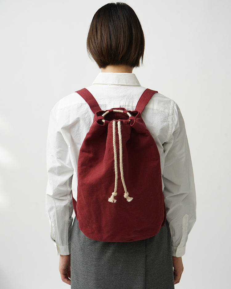 YAECA (WOMEN) / Drawstring Backpack / KUSAKI RED