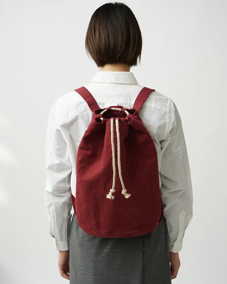 YAECA (WOMEN) / Drawstring Backpack / KUSAKI RED